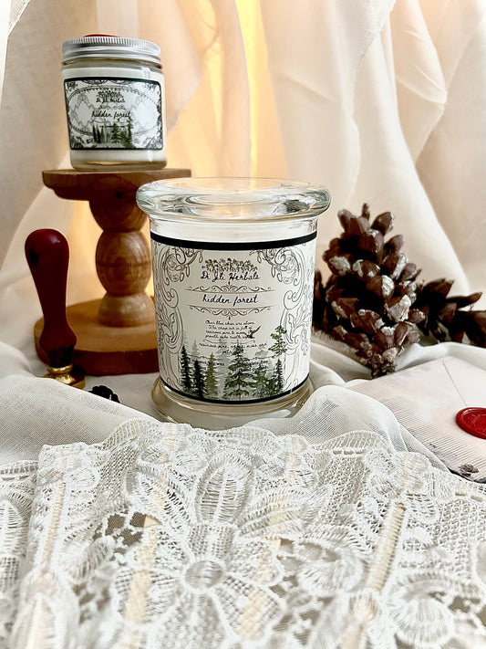 Hand-poured Victorian romantic-inspired candle with elegantly designed hidden forest label on a white lace tablecloth